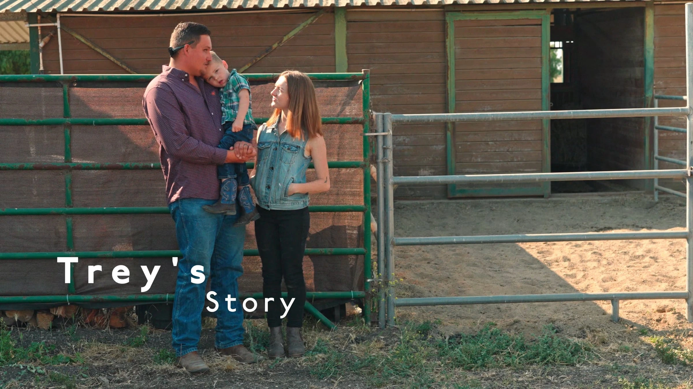 Family standing together at a farm